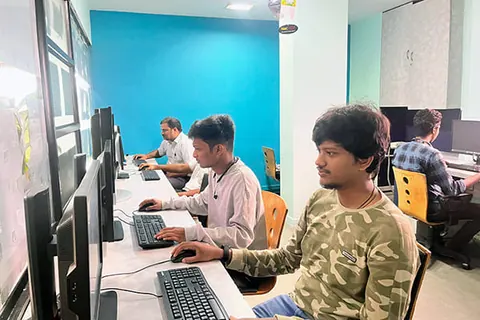 Students at workstations in the lab
