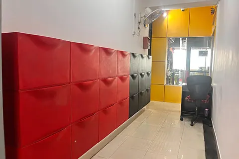 Corridor with red lockers at the Frameboxx centre